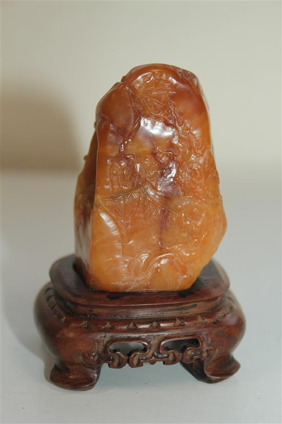 A Chinese Tianhuang stone landscape carving, 136g., 7 x 4 x 3.5cm, wood stand